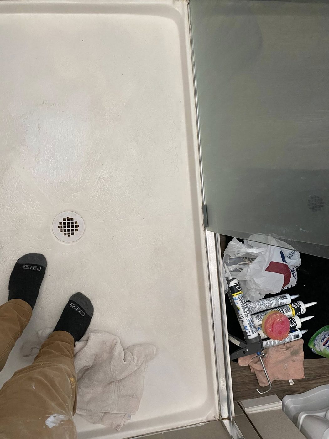 Re-caulked shower pan and door